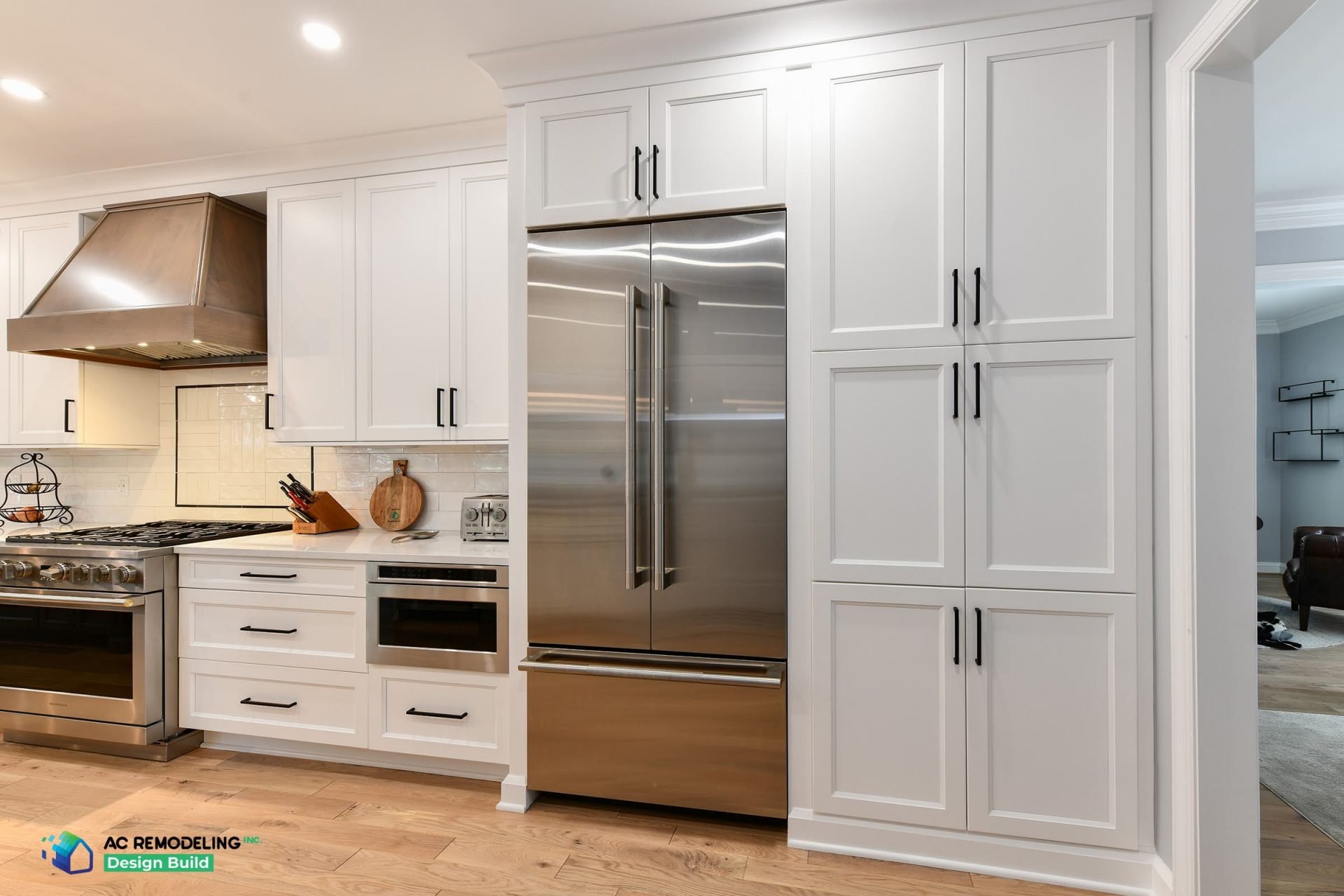 Custom kitchen with installed cabinetry and stone countertops after a full remodel